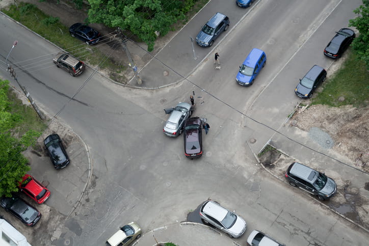 An aerial view of a car accident at an intersection.