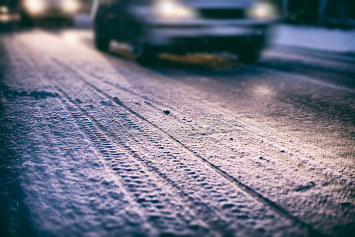 A car driving over snow and ice.